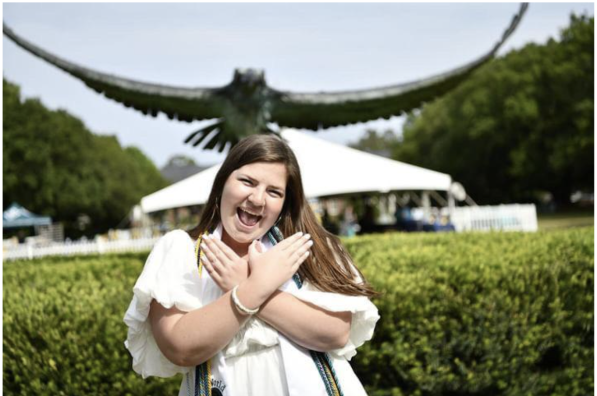 UNCW alum, Maddie Miller, poses in front of the iconic Seahawk statue. (Courtesy of Maddie Miller, UNCW class of 2023)